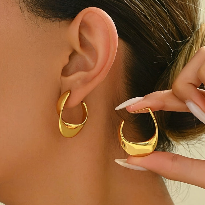 Boucles d'oreilles créoles sculptées en croissant | Or