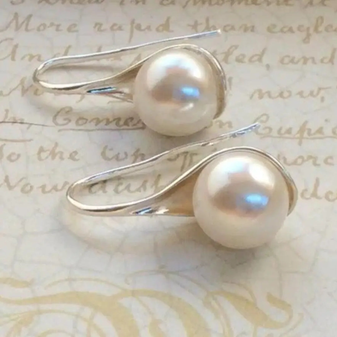 Boucles d'oreilles en forme de goutte avec des marguerites | Or