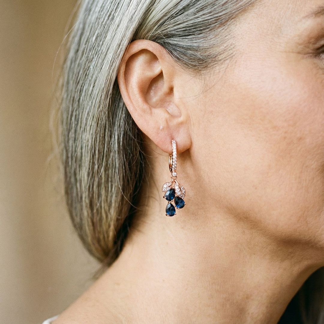 Boucles d'oreilles pendantes avec des cristaux bleus | Or