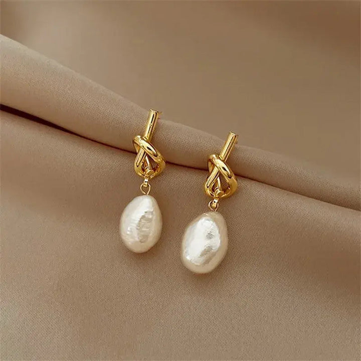 Boucles d'oreilles pendantes avec perles baroques | Or