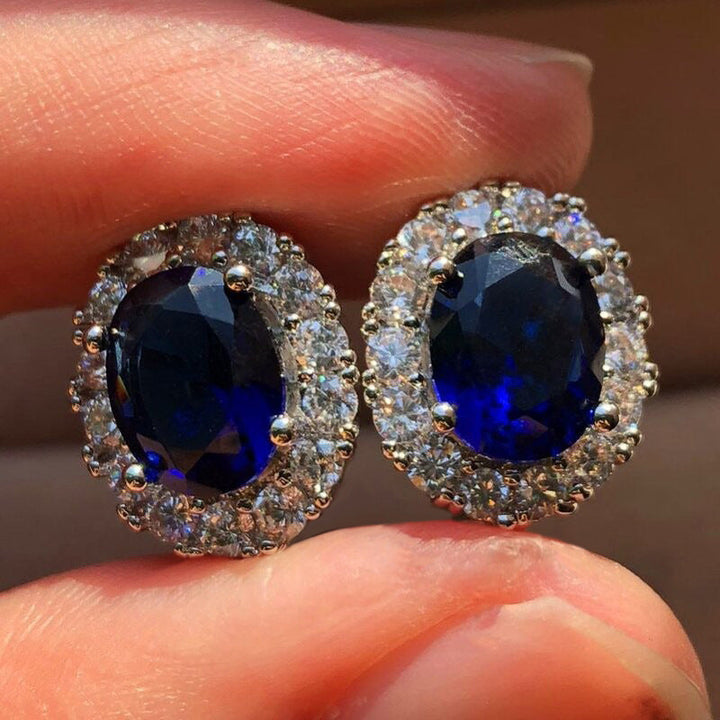 Boucles d'oreilles puces en saphir blanc ovale | Or blanc