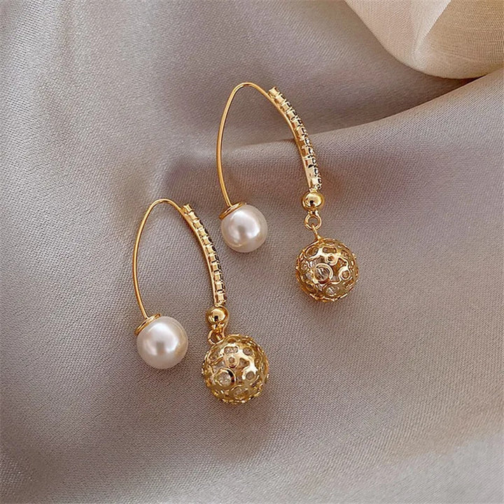 Boucles d'oreilles rétro avec des marguerites | Or